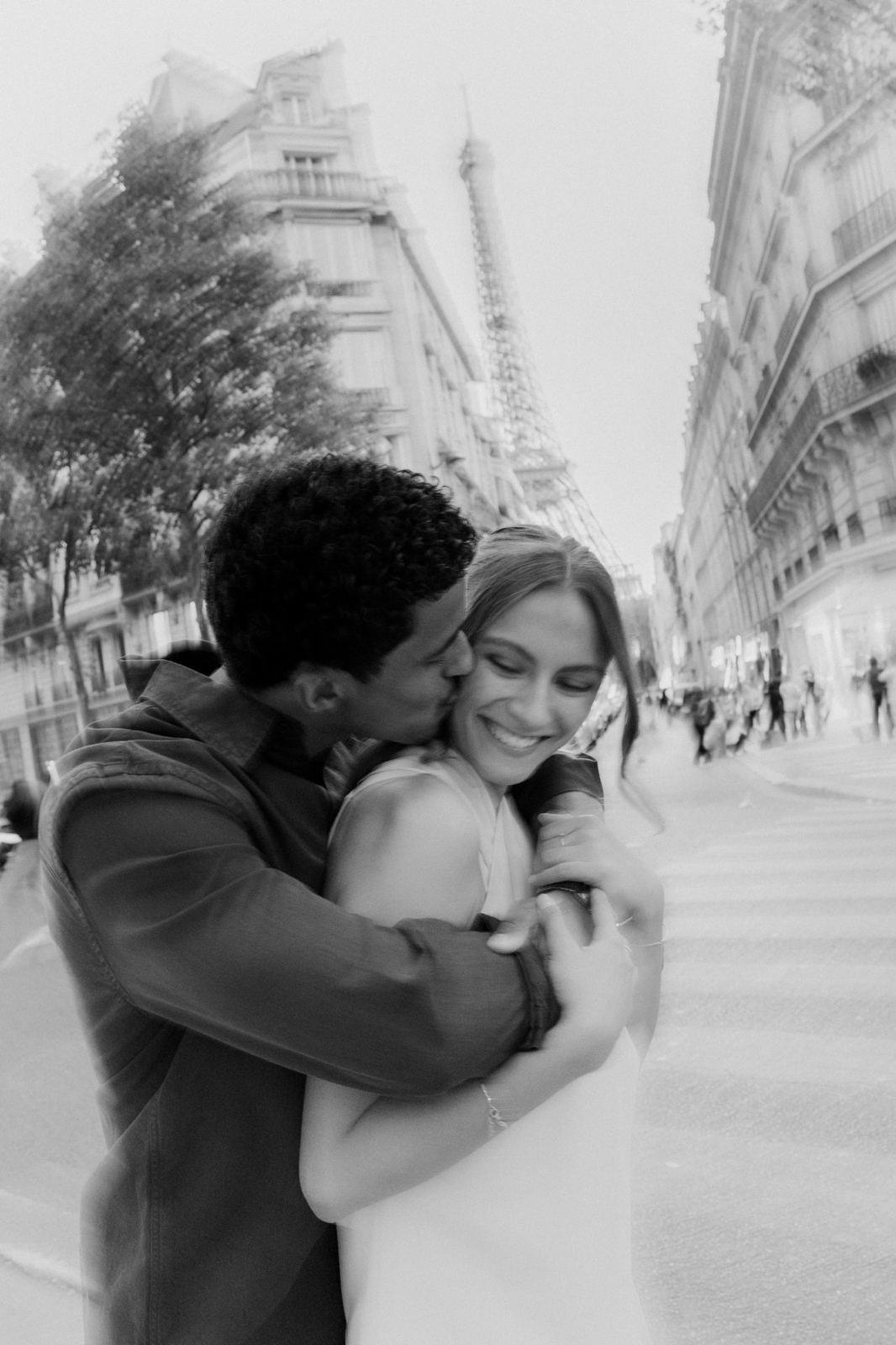 Kiss on the cheek near the Eiffel Tower, black and white