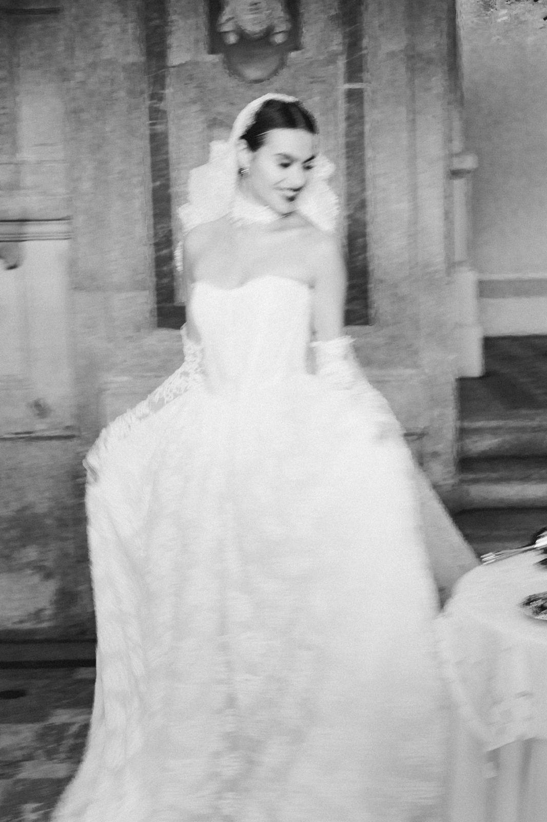 Bride in motion, her dress flowing