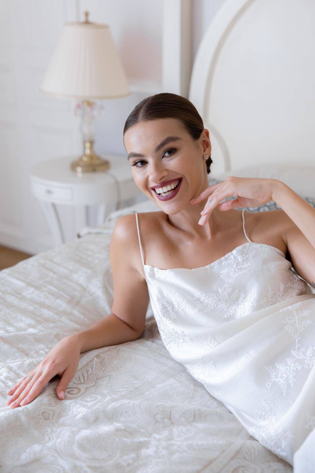 Bride smiling while getting ready