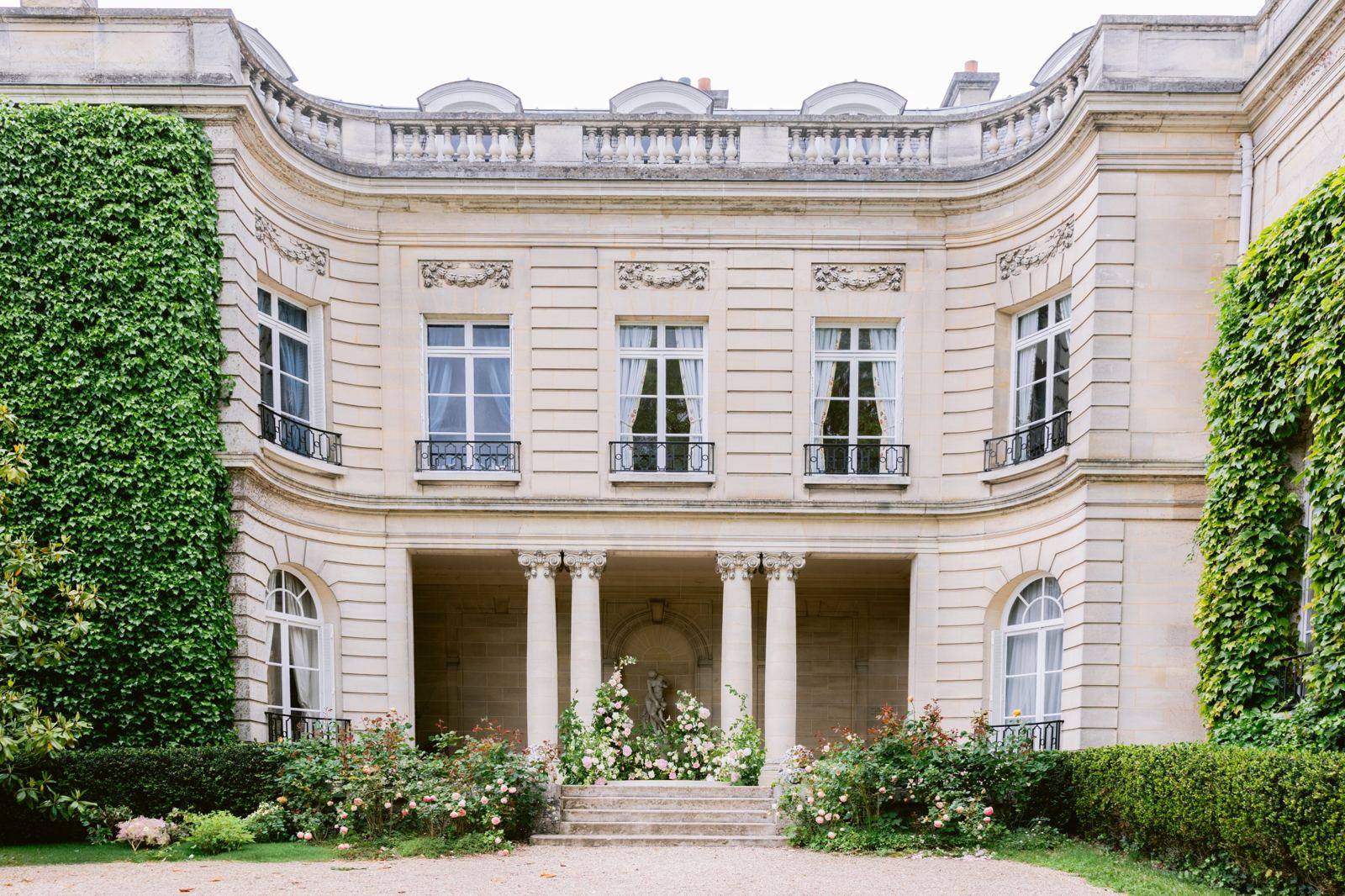 Château façade with climbing roses, a wedding venue in France