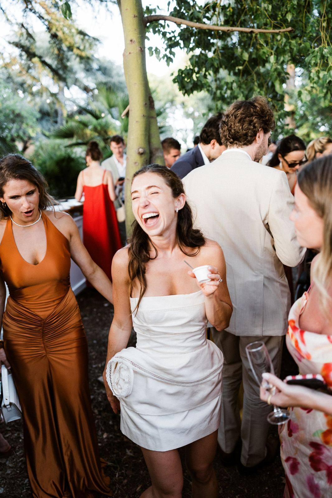 Guests laughing during the cocktail hour