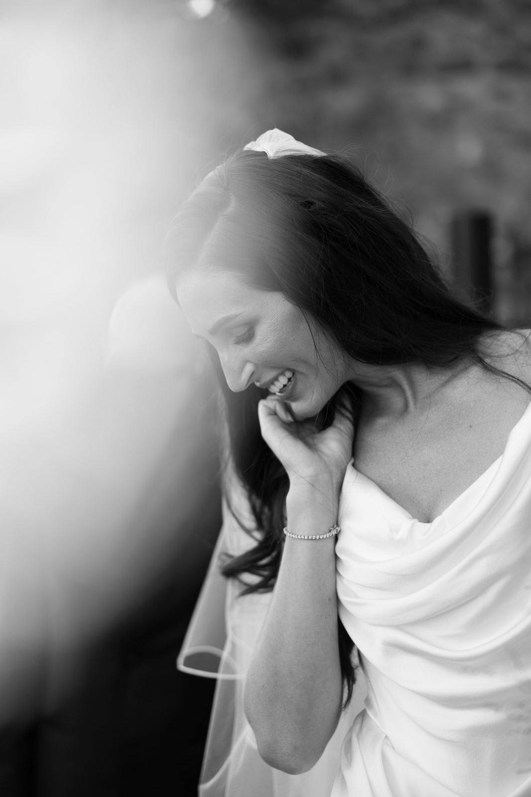 Newlyweds laughing, black and white