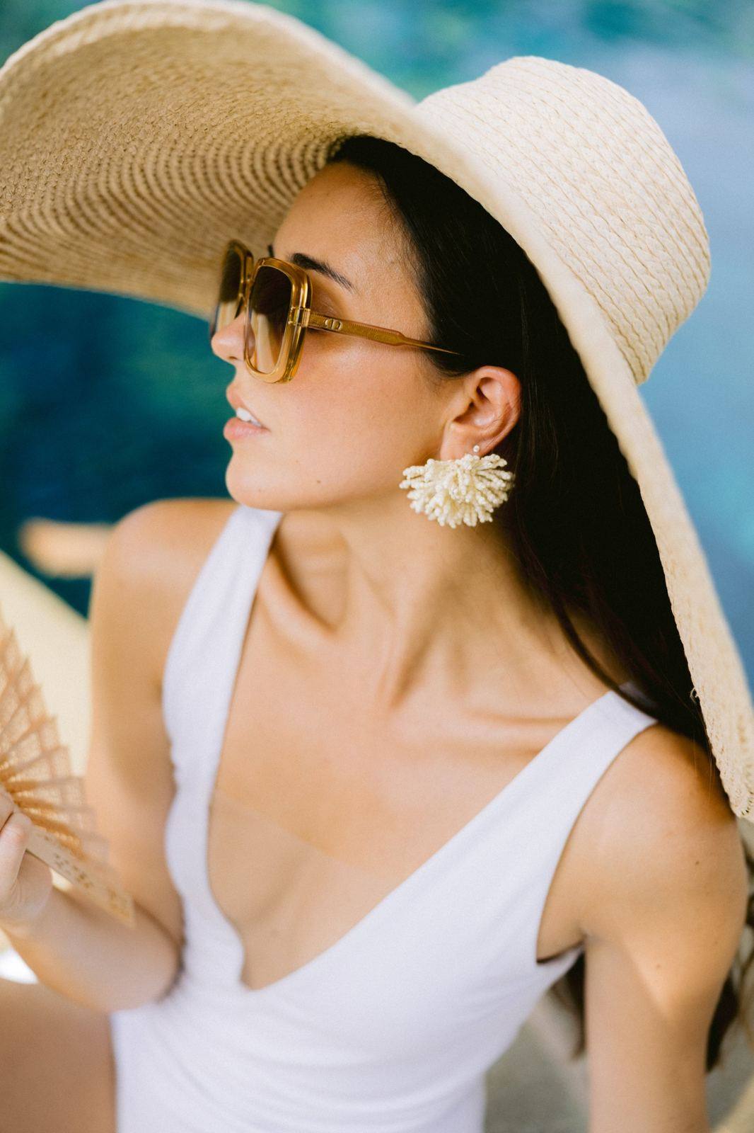 Wedding guest in a straw hat