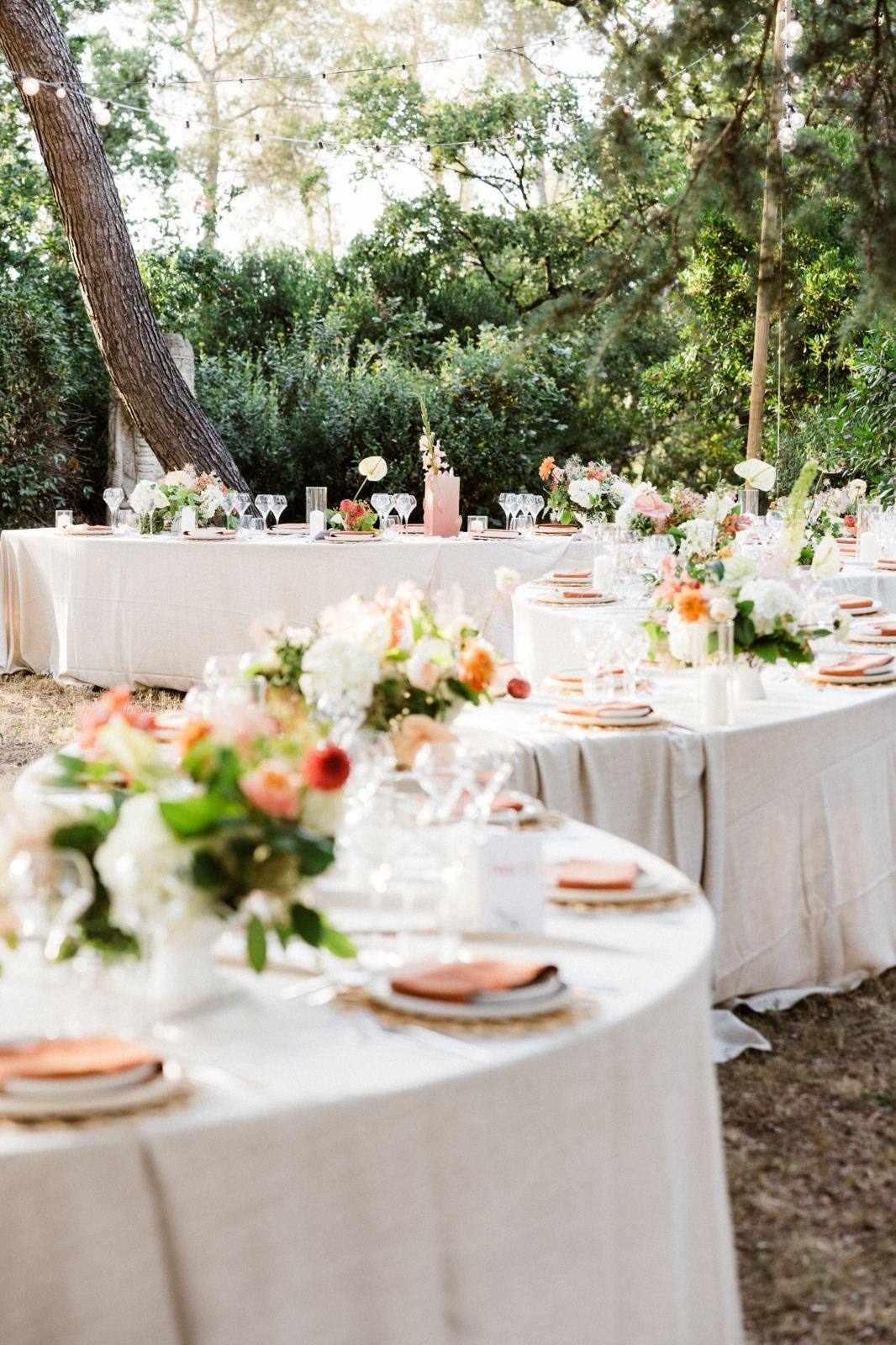 Reception tables under pine trees