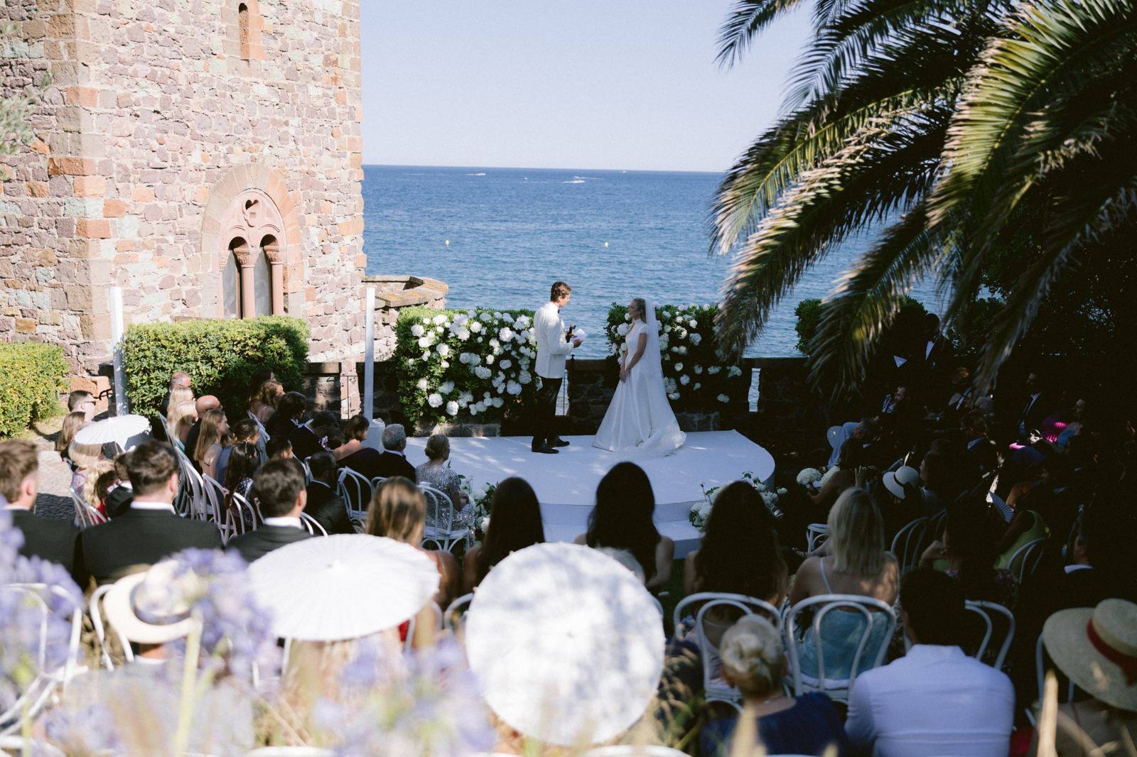 Outdoor wedding ceremony facing the sea
